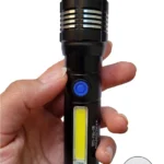 تصویری از چراغ قوه پلیسی زوم دار مدل mx-981 در دست
