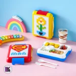 تصویری از ظرف غذای لگویی کودک 1100 میلی‌لیتر با 500 قطعه لگو در دو رنگ زرد و قرمز